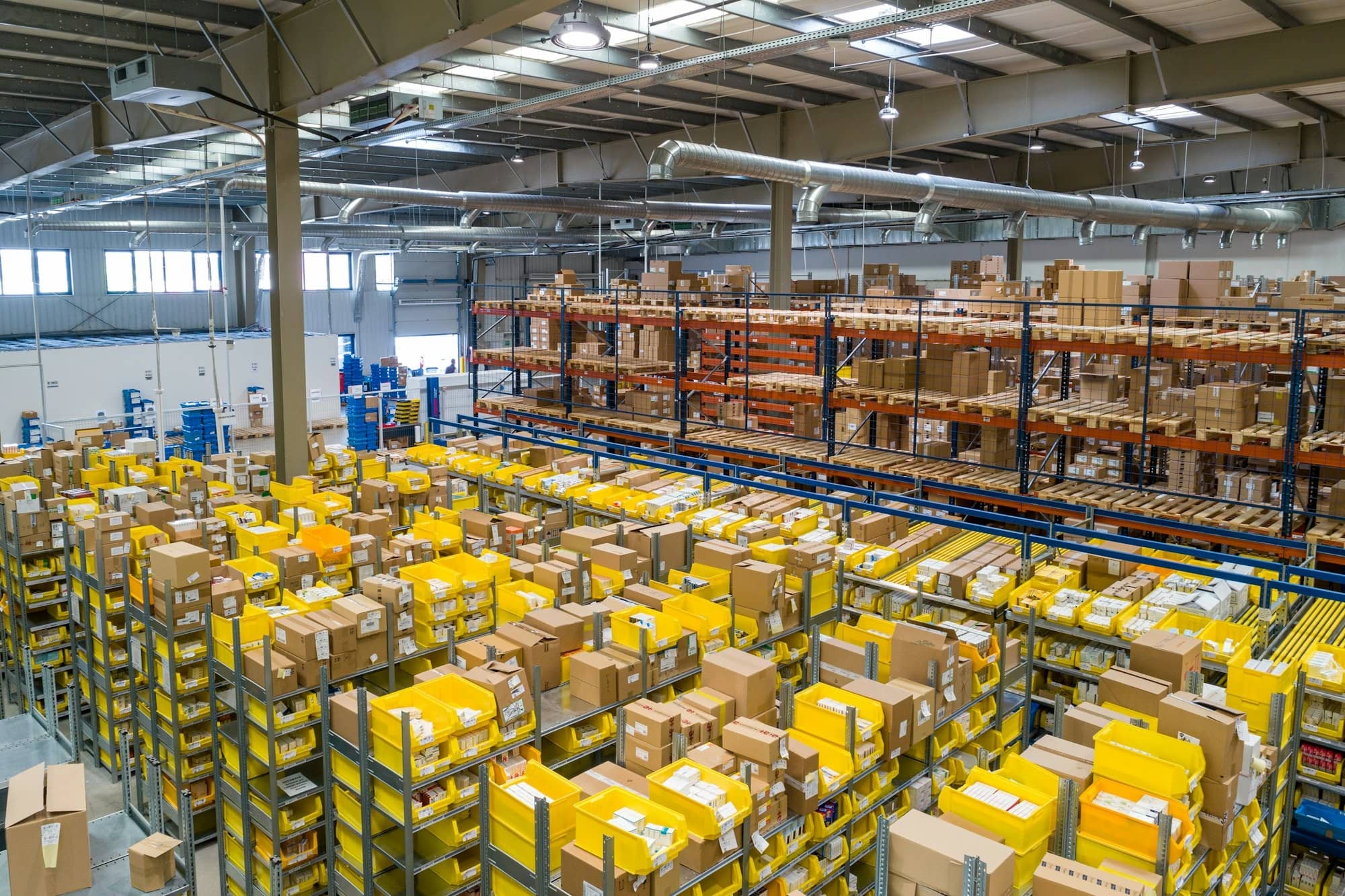 Stock in bins on the warehouse floor